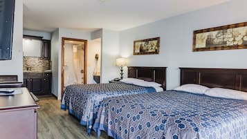 Economy Room, 2 Queen Beds, Kitchenette | Free WiFi, bed sheets