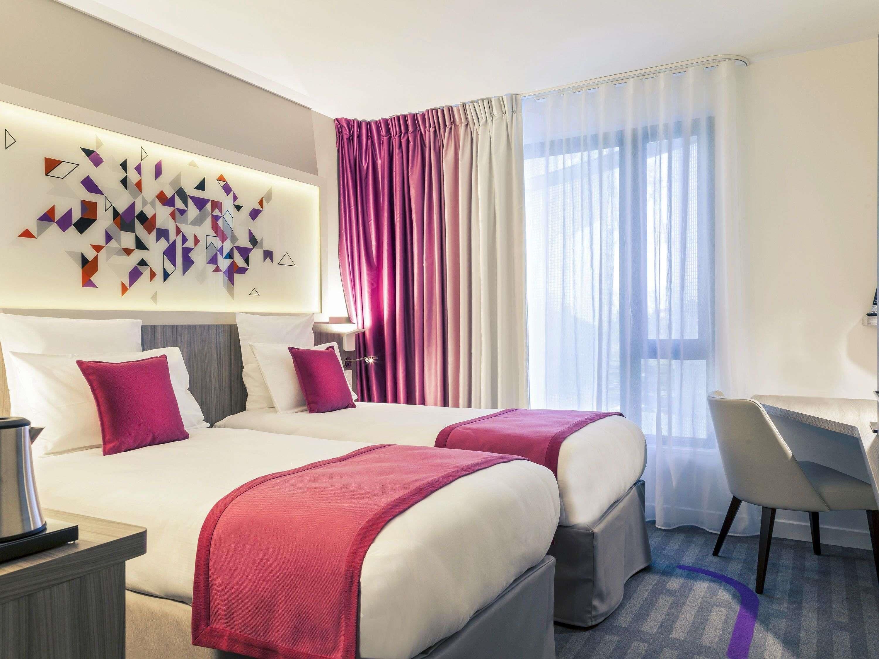 Luxe beddengoed, een minibar, een kluis op de kamer, een bureau