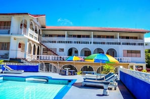 Outdoor pool, open 9:00 AM to 6:00 PM, pool loungers