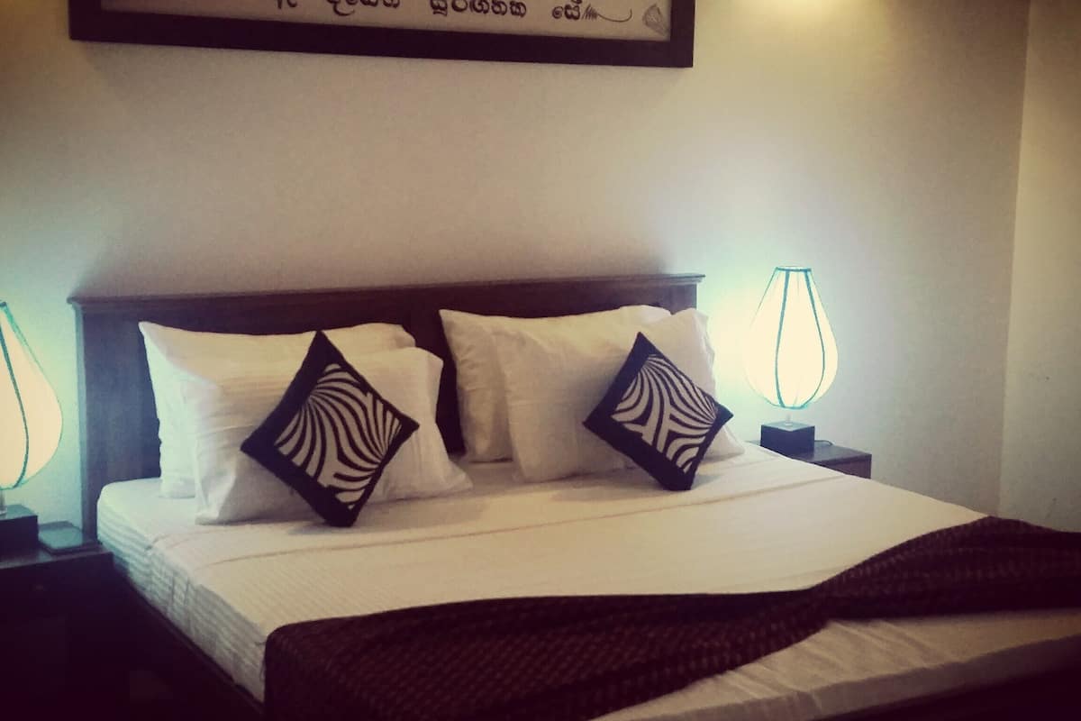 deluxe double room, 1 king bed, lake view, lakeside | 1 bedroom, premium bedding, minibar, individually decorated