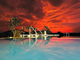 Outdoor pool, an infinity pool, sun loungers