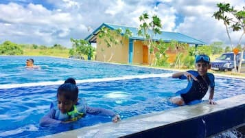 Outdoor pool, an infinity pool, sun loungers