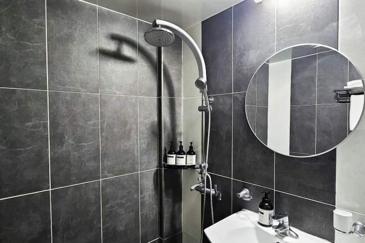 Bathroom | Shower, hair dryer, slippers, heated floors