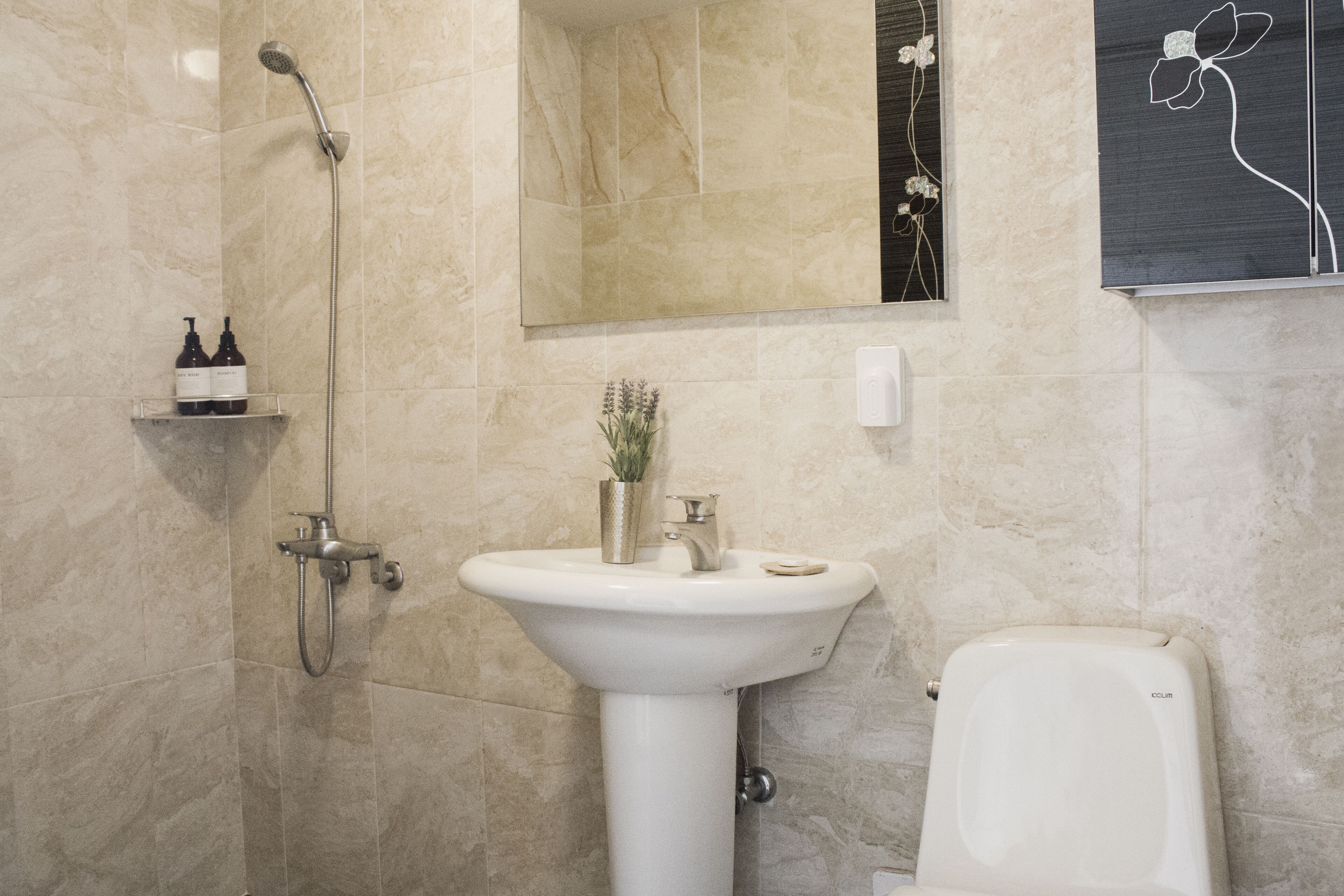 shower, hair dryer, slippers, towels