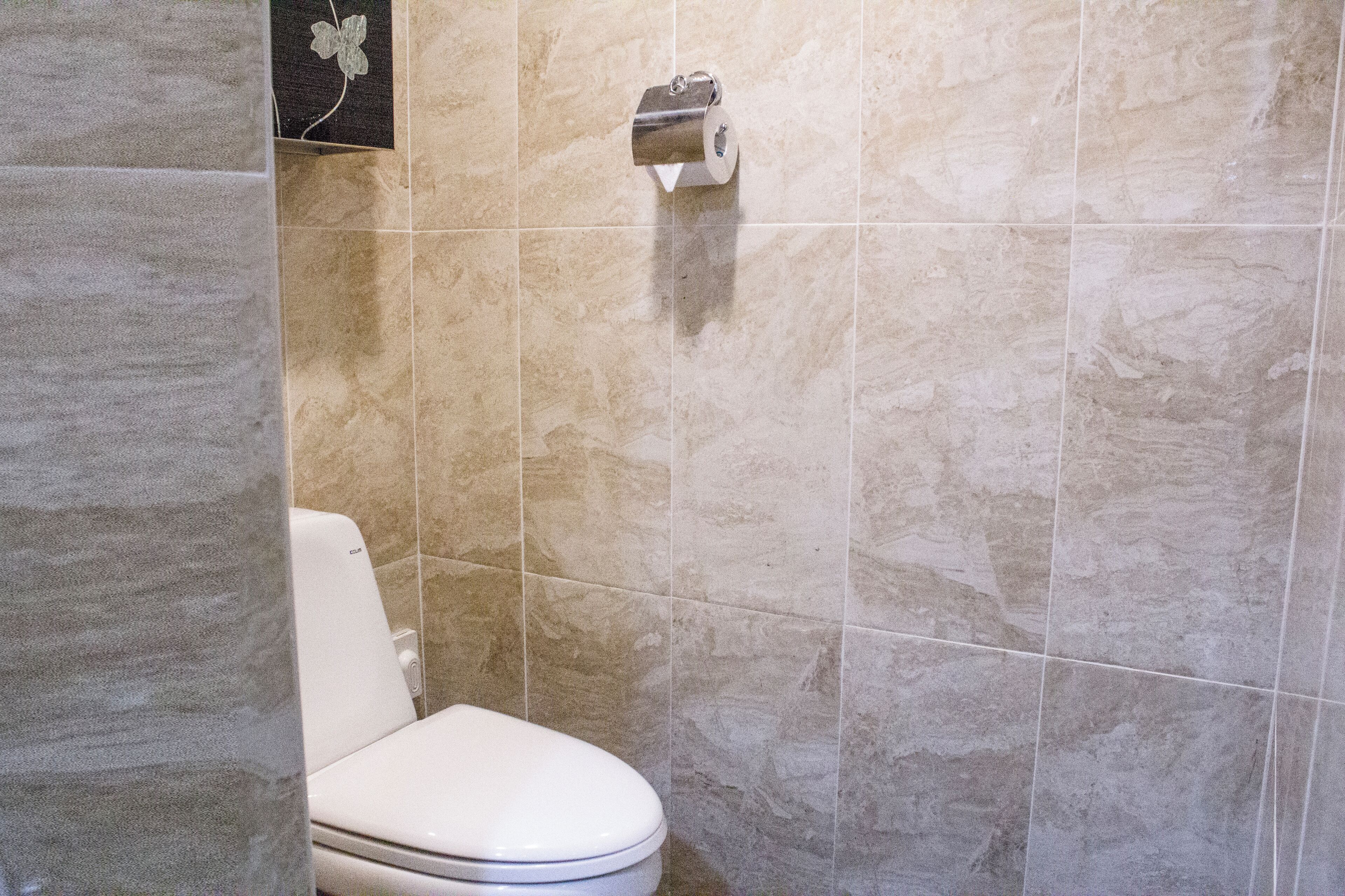 resort room | bathroom | shower, hair dryer, slippers, towels