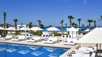 Indoor pool, outdoor pool, pool umbrellas, pool loungers