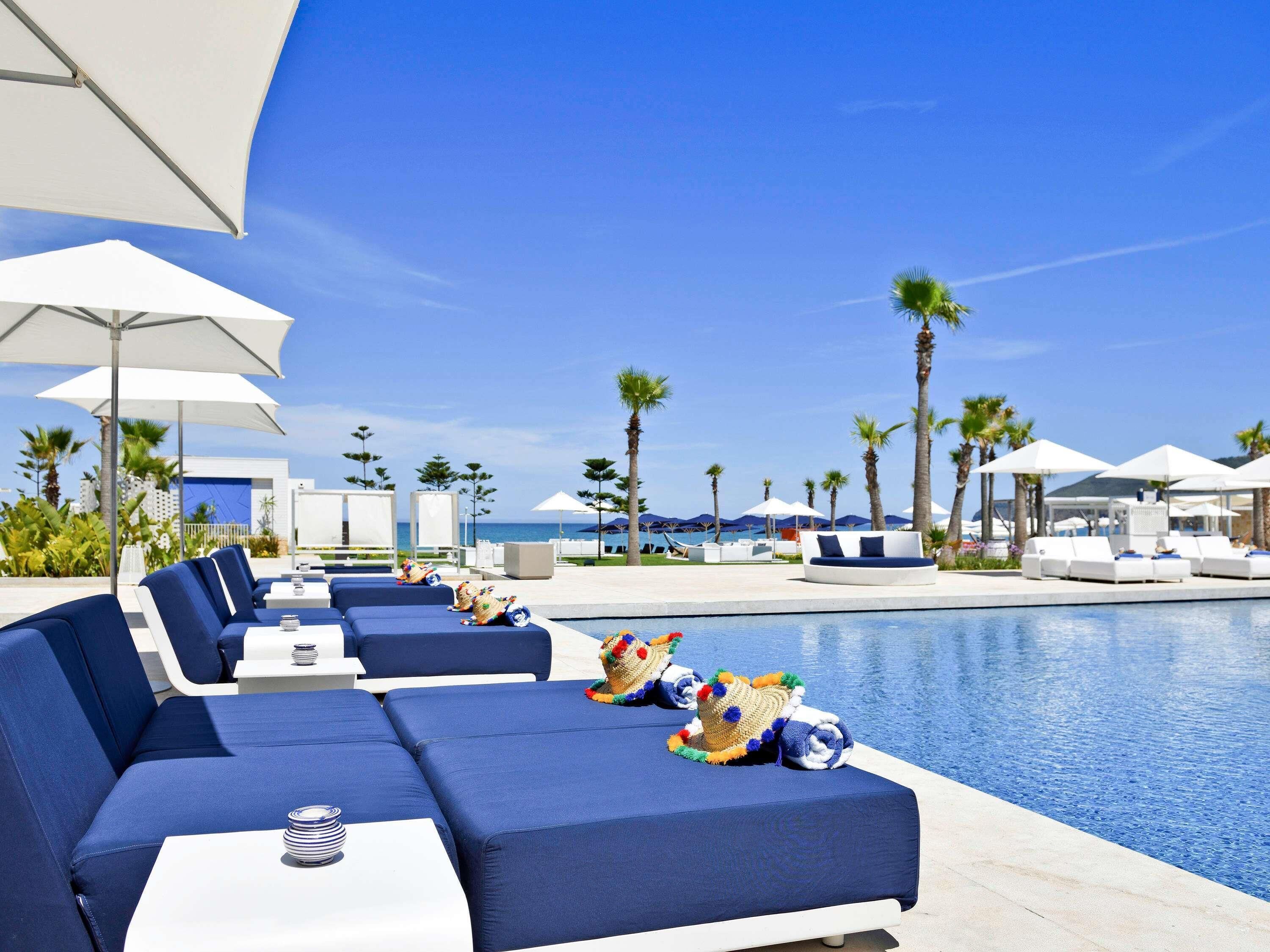 Indoor pool, outdoor pool, pool umbrellas, pool loungers