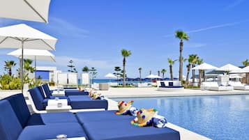 Indoor pool, outdoor pool, pool umbrellas, pool loungers