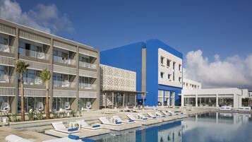 Indoor pool, outdoor pool, pool umbrellas, pool loungers