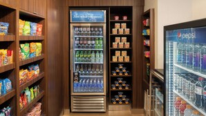 A self-service beverage and snack vending area with various brands and types of products. - Fairfield Inn & Suites by Marriott Santa Cruz, CA (Santa Cruz)