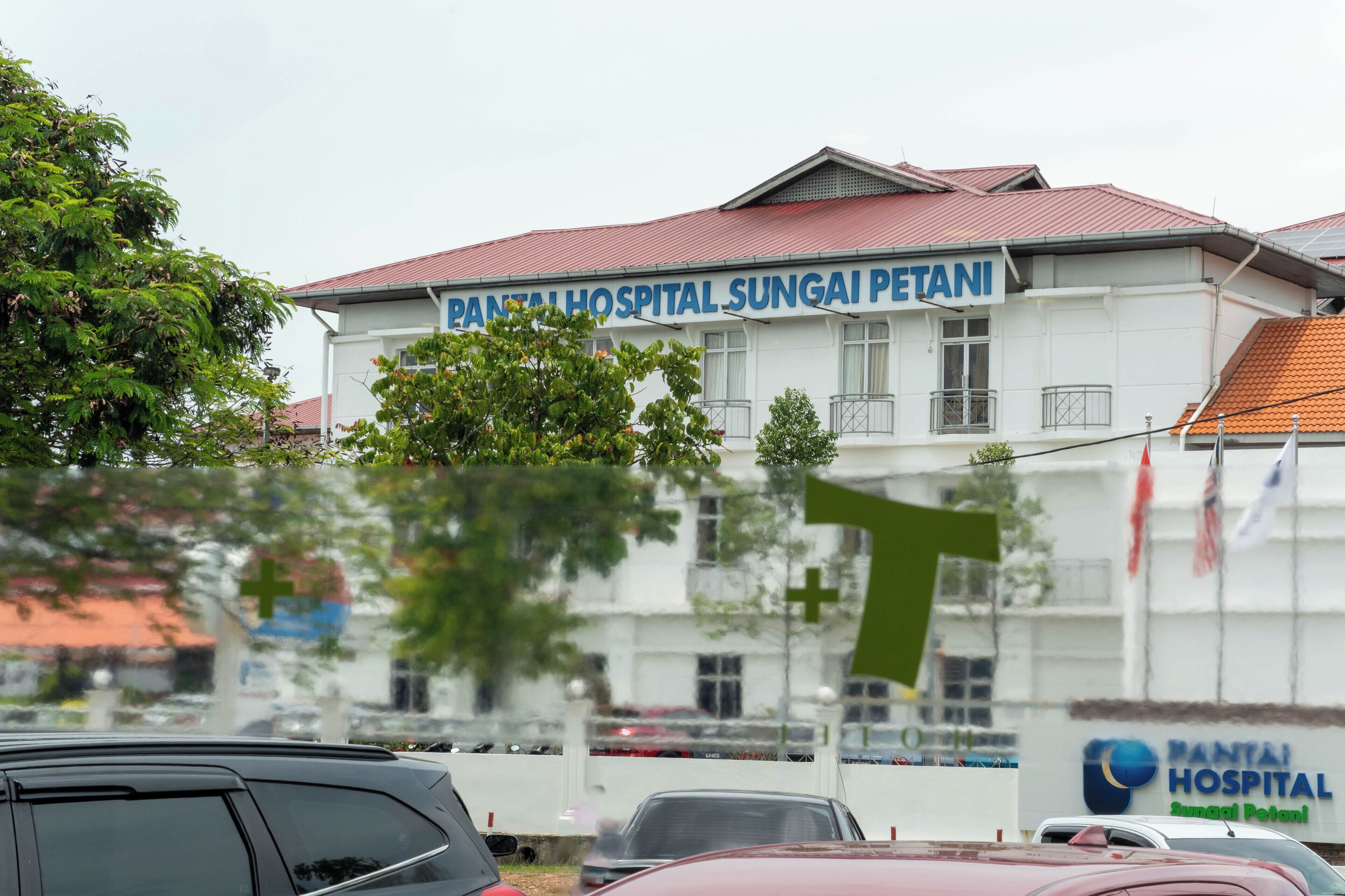 A hospital building with a sign reading "PANTAI HOSPITAL SUNGAI PETANI".