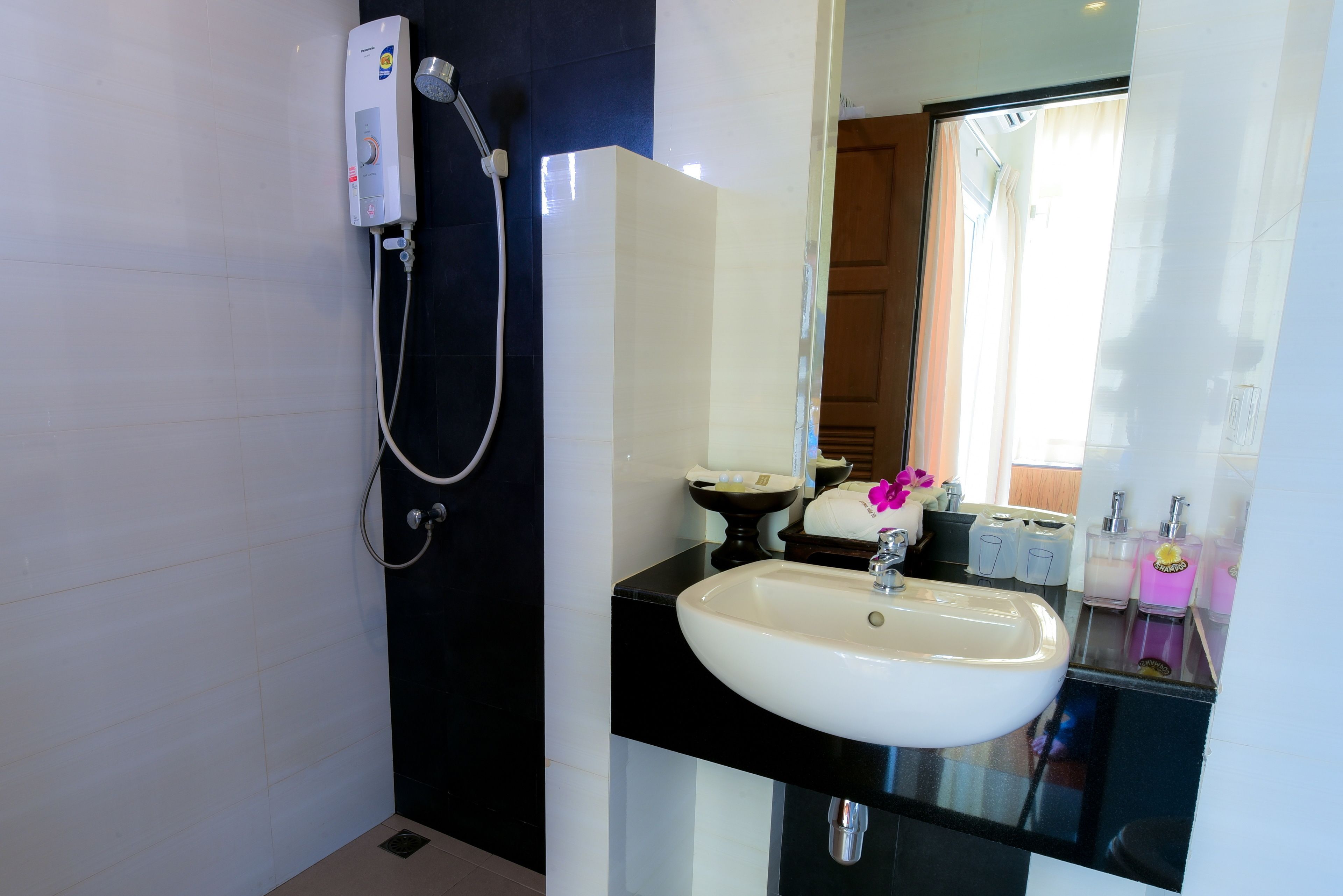 premium | bathroom | shower, free toiletries, hair dryer, towels