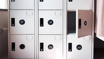 A set of six metal safes with numbered locks, arranged in two columns.