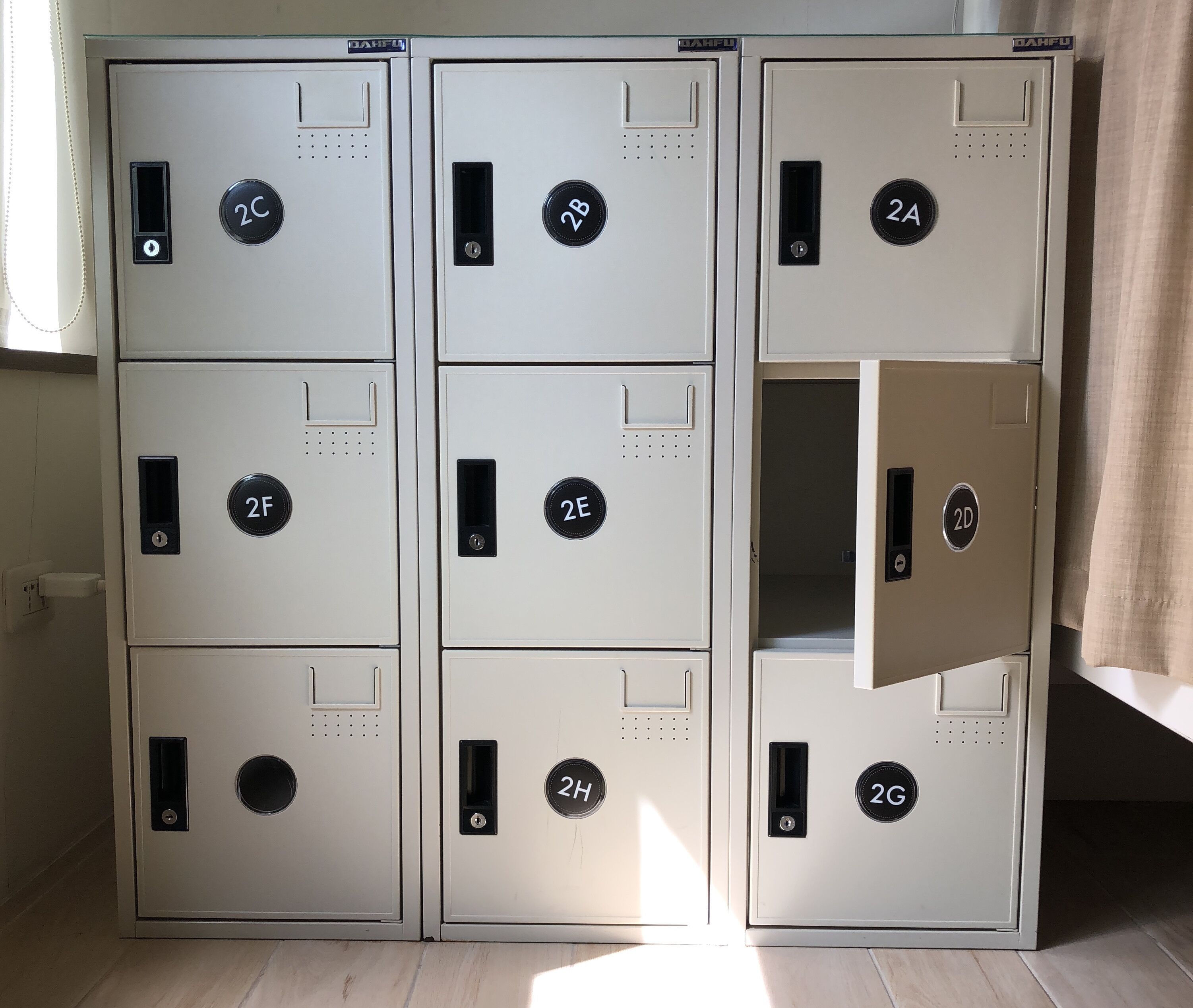 Six metal storage lockers with numbered locks, arranged in two rows.
