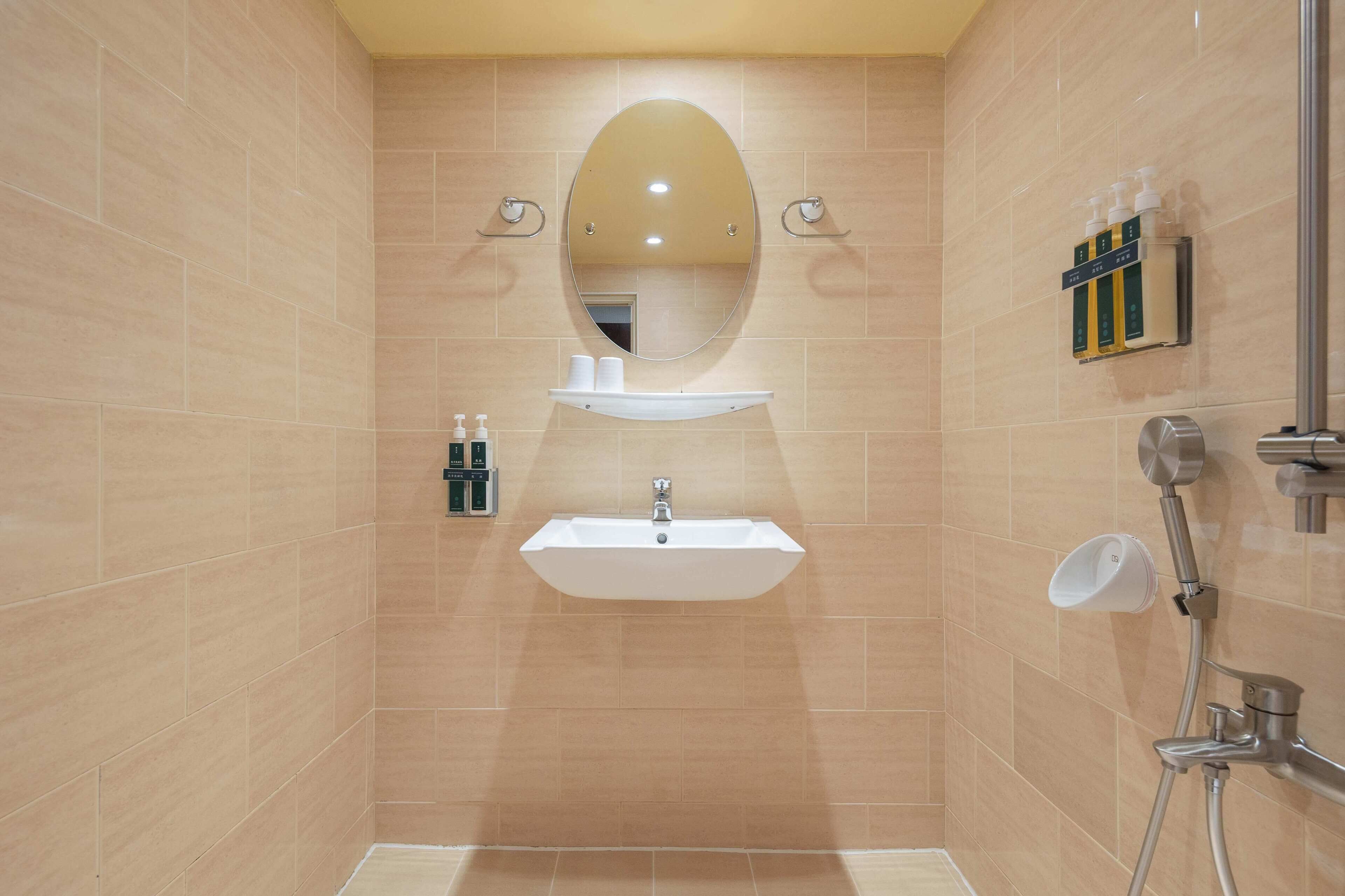 Shower, hair dryer, slippers, towels