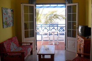 Apartment, 1 Bedroom | Living room | TV - Atlantis Las Lomas (Tías)