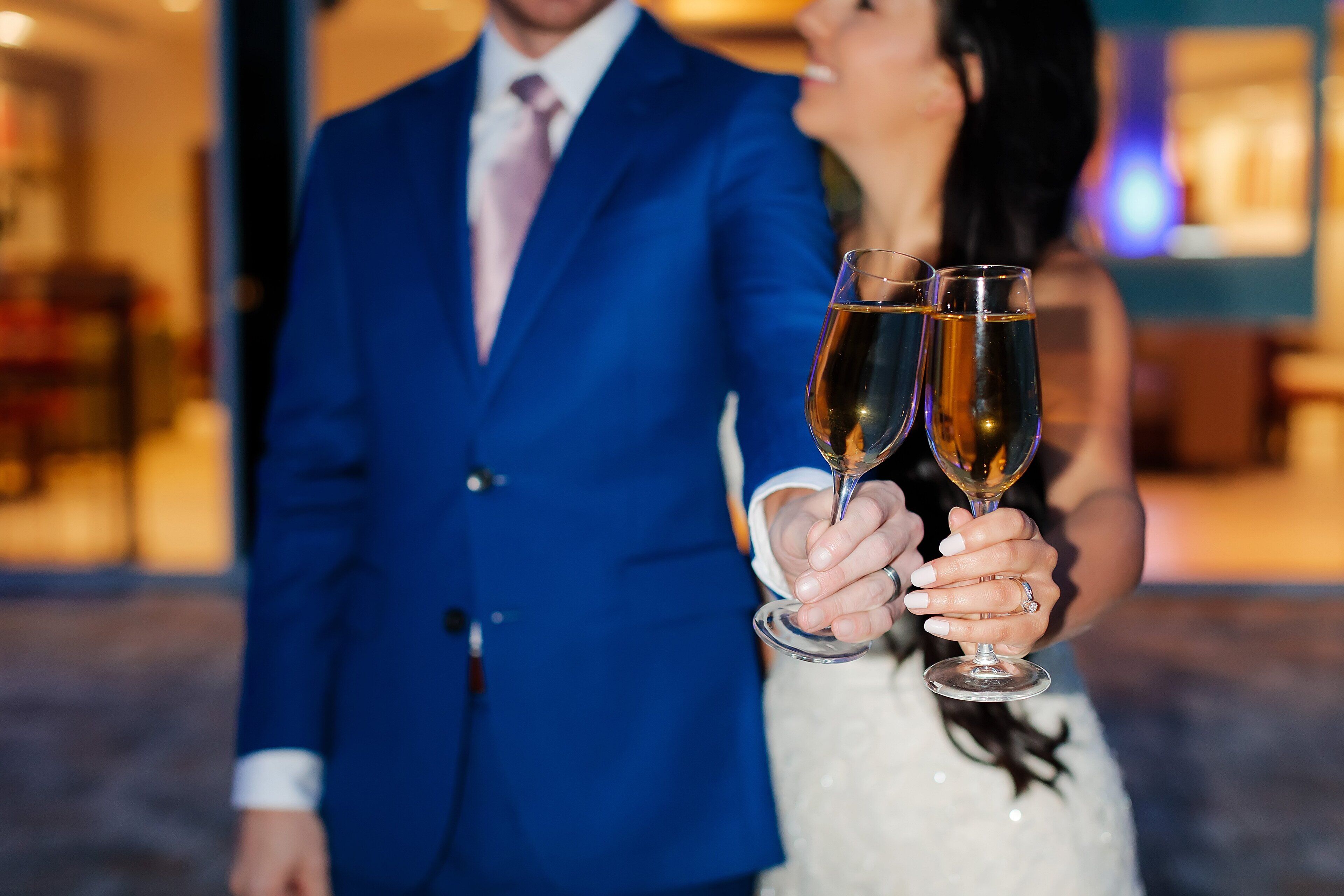 A couple holding champagne glasses.