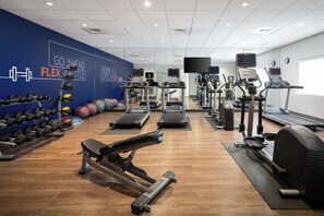 A gym with treadmills, elliptical machines, and free weights. - Holiday Inn Express & Suites Trinity by IHG (Trinity)