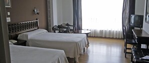 Desk, blackout curtains, free cots/infant beds, rollaway beds