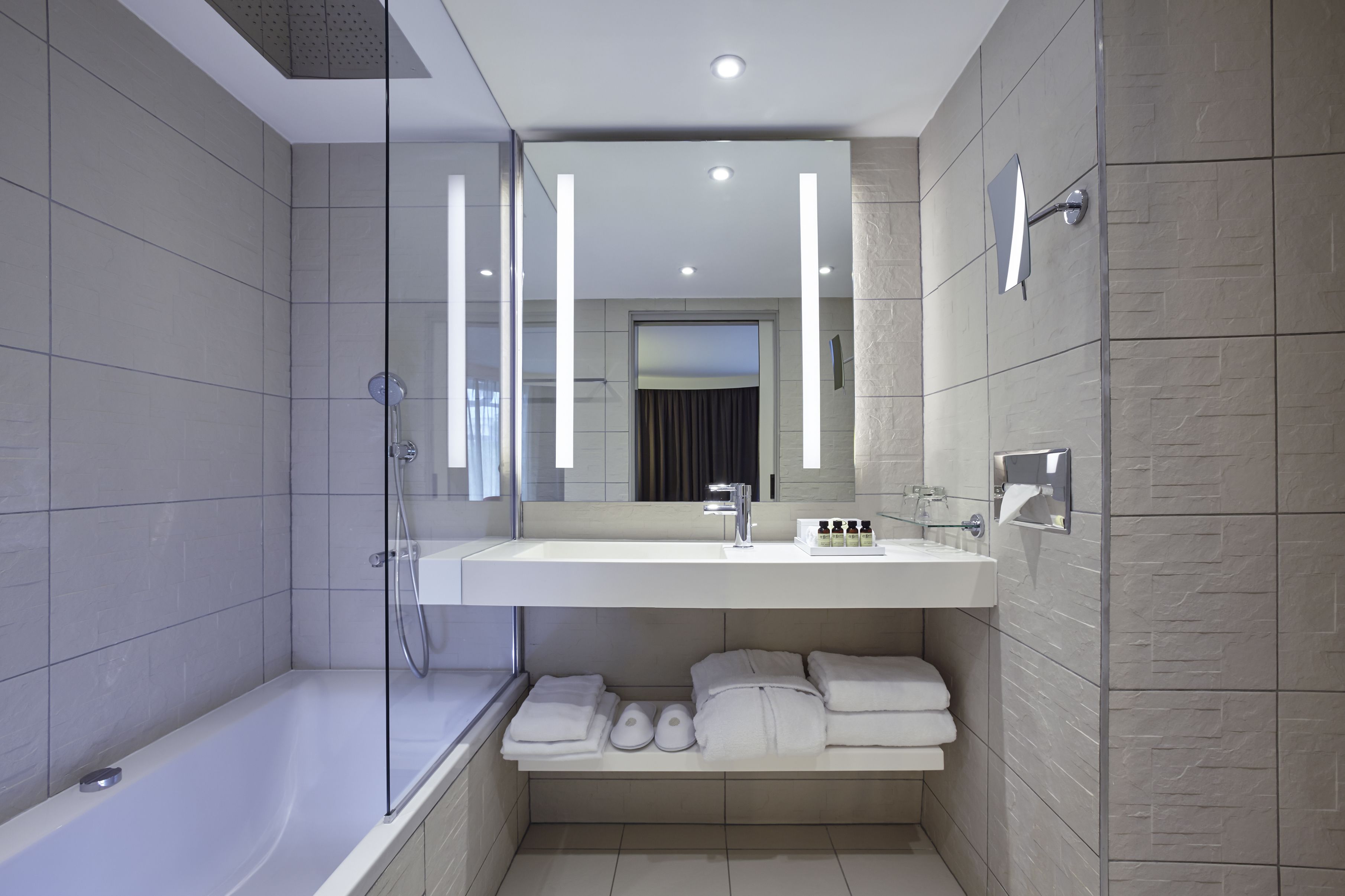 superior suite, 1 king bed with sofa bed | bathroom | rainfall showerhead, designer toiletries, hair dryer, bathrobes