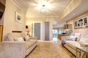 Superior Apartment, 3 Bedrooms (1king, 1 double, bunk bed + sofa bed) | Living area | Flat-screen TV, DVD player
