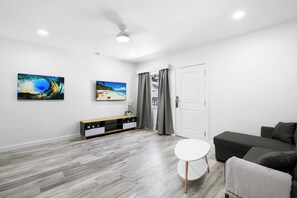 Grand Suite | Living area | 50-inch Smart TV with cable channels, TV, Hulu - The Hotel Deauville (Fort Lauderdale)