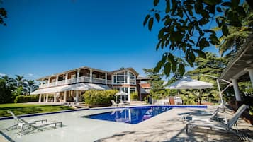 Outdoor pool, open 7:00 AM to 10:00 PM, pool loungers