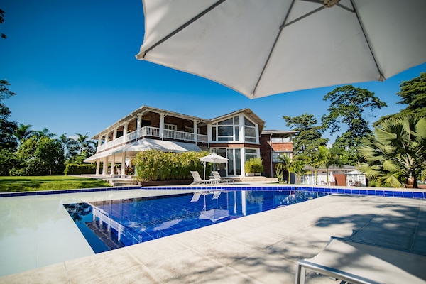 Outdoor pool, open 7:00 AM to 10:00 PM, pool loungers