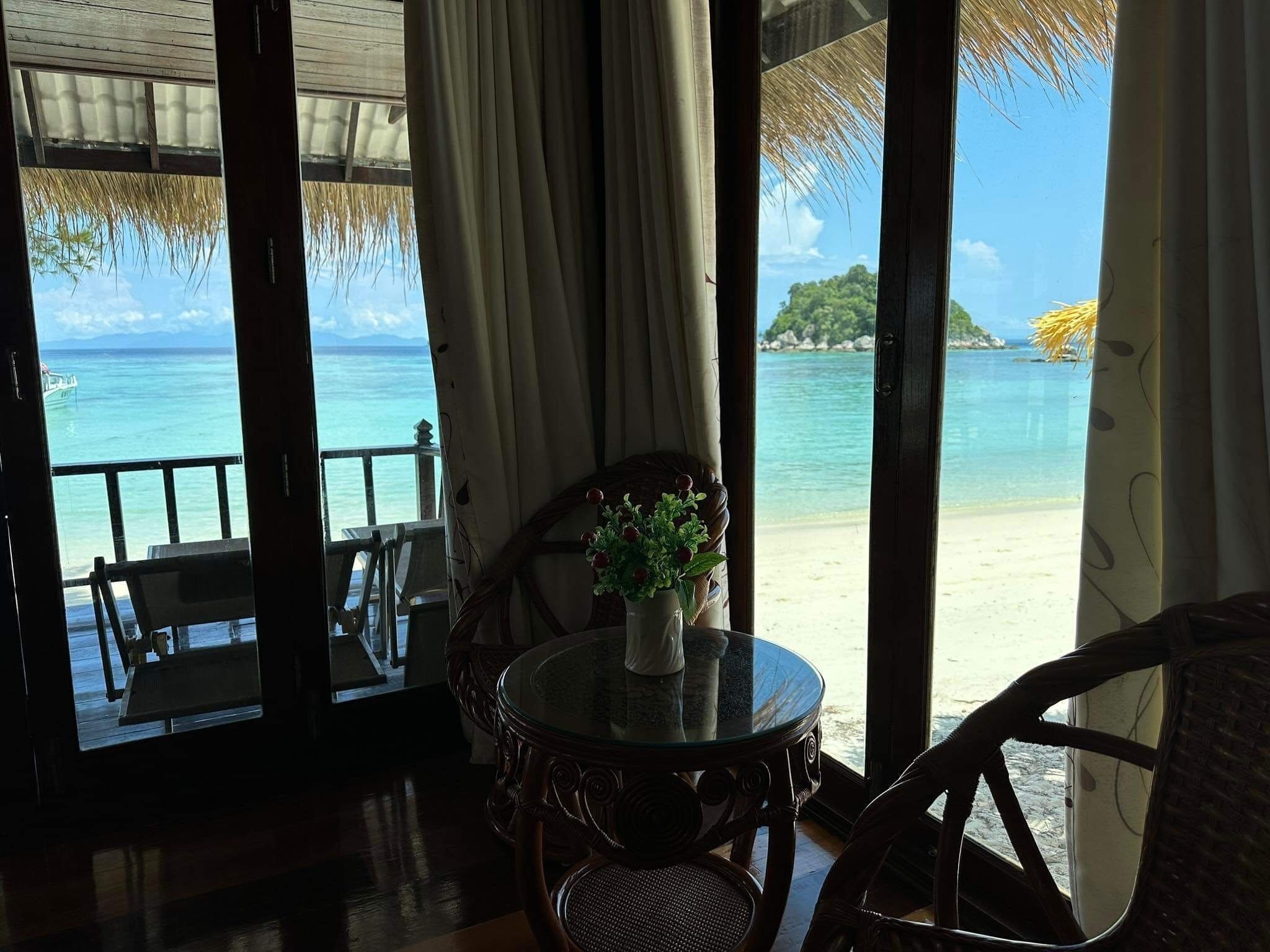 Deluxe Beachfront Villas | Living area | 32-inch TV with cable channels
