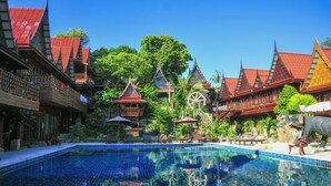 A traditional Thai-style building with a swimming pool. - Anda Resort Koh Lipe (Koh Lipe)