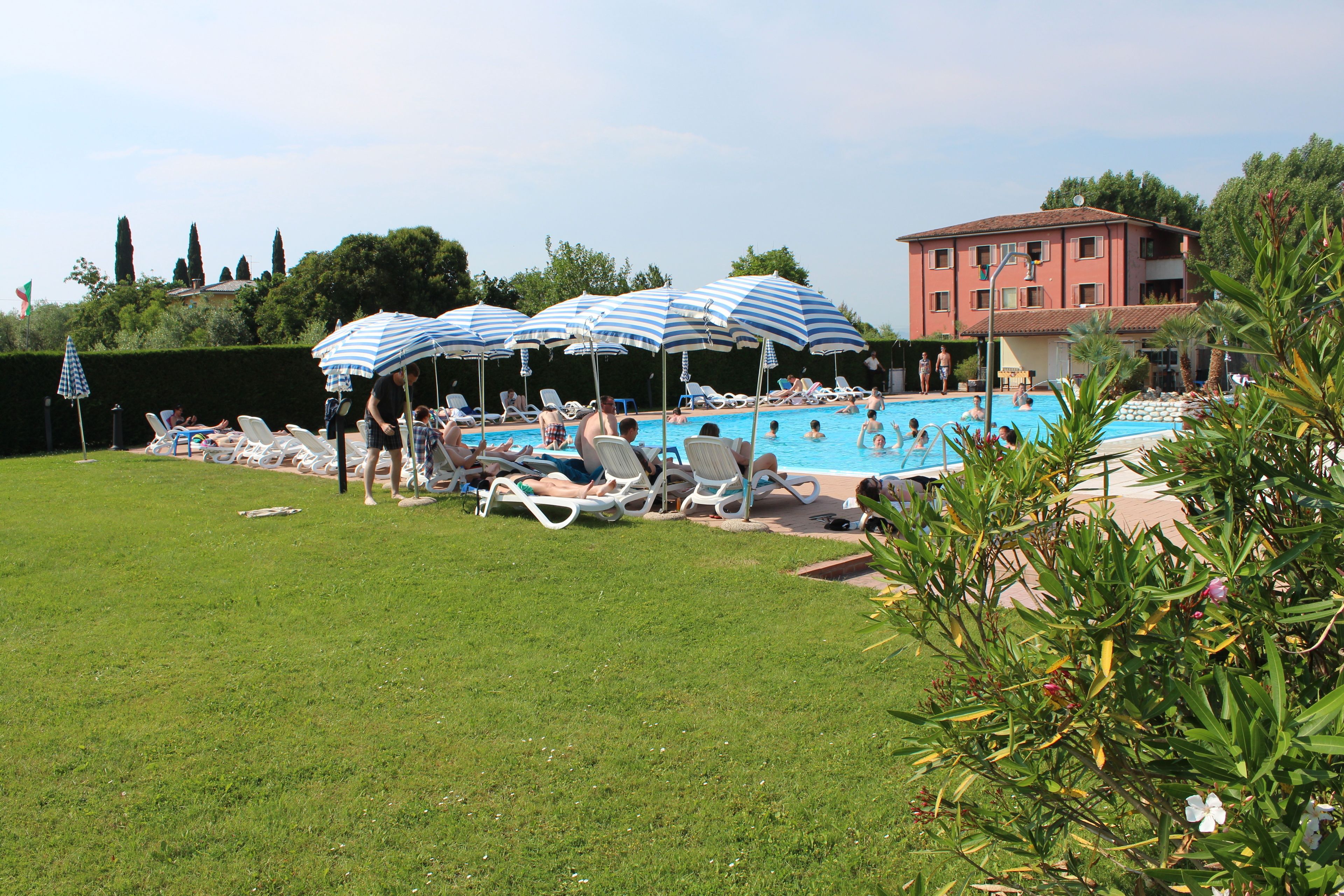 outdoor pool, open 7:00 am to 9:00 pm, pool umbrellas, pool loungers
