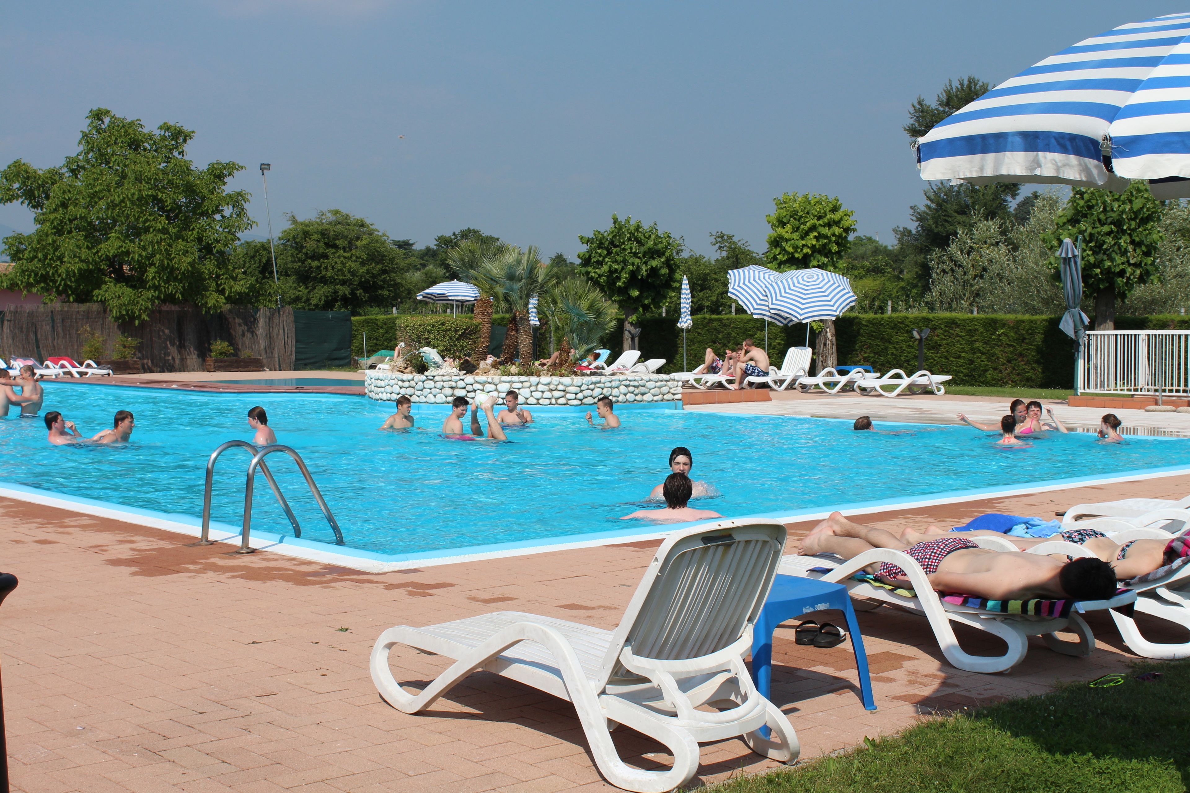 outdoor pool, open 7:00 am to 9:00 pm, pool umbrellas, pool loungers