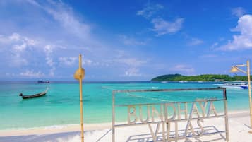 On the beach, sun loungers, beach umbrellas, beach towels
