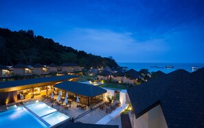 A resort with multiple bungalow-style buildings, a swimming pool, and a view of the ocean. - Bundhaya Villas Koh Lipe (Koh Lipe)