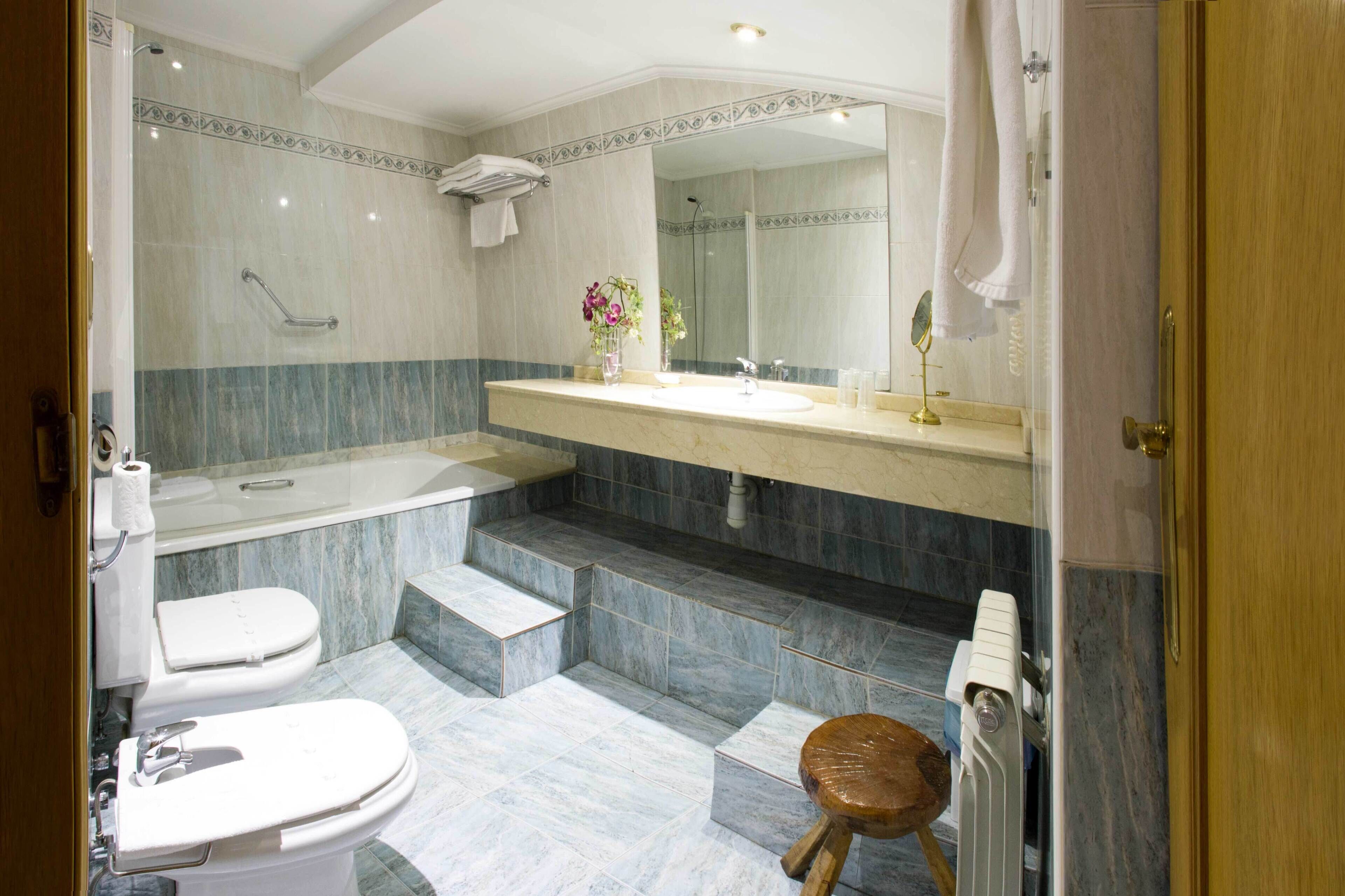 free toiletries, hair dryer, bidet, towels