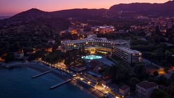 Enjoy a refreshing swim in our central pool surrounded by lush hills and modern architecture.