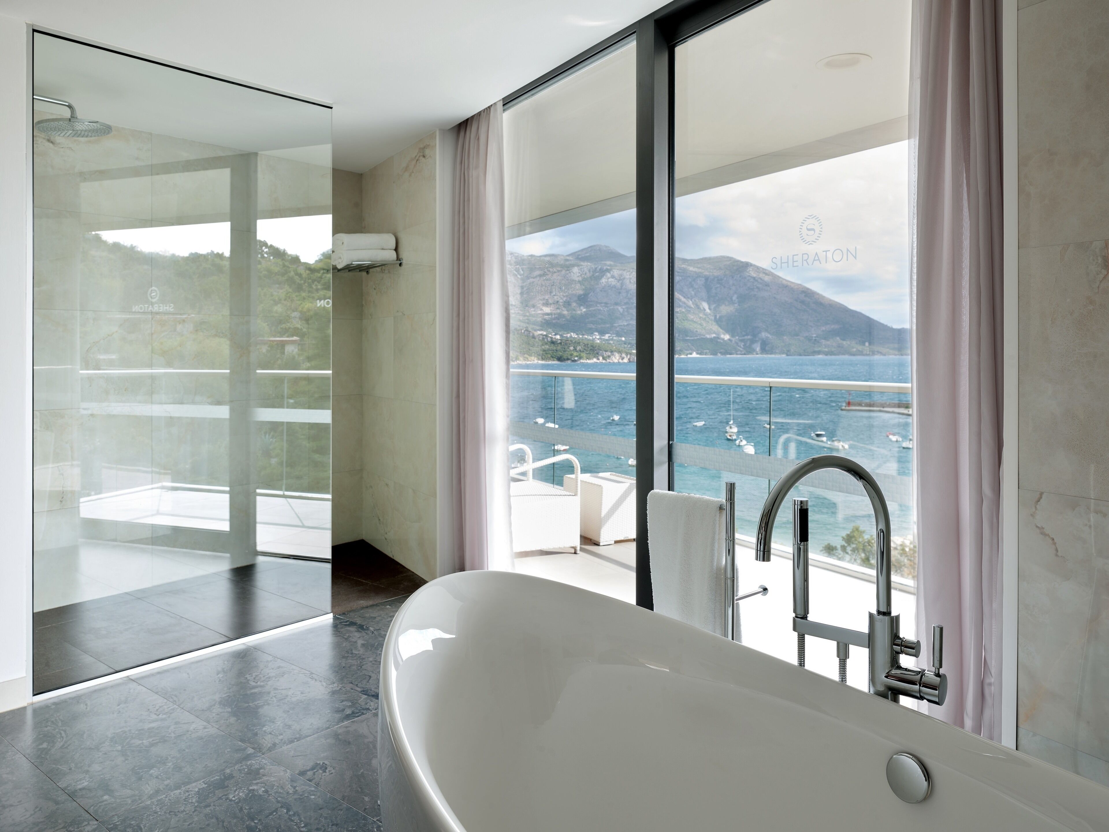 suite, 1 bedroom, sea view | bathroom | separate bathtub and shower, deep-soaking bathtub, free toiletries