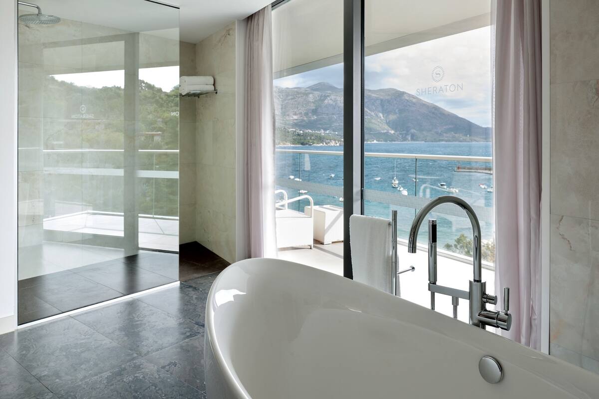 suite, 1 bedroom, sea view | bathroom | separate bathtub and shower, deep-soaking bathtub, free toiletries