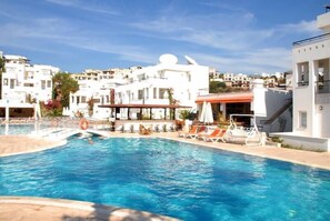 Outdoor pool, pool umbrellas, pool loungers