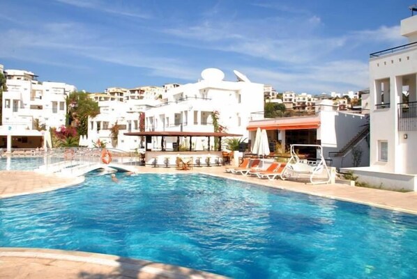 Outdoor pool, pool umbrellas, pool loungers