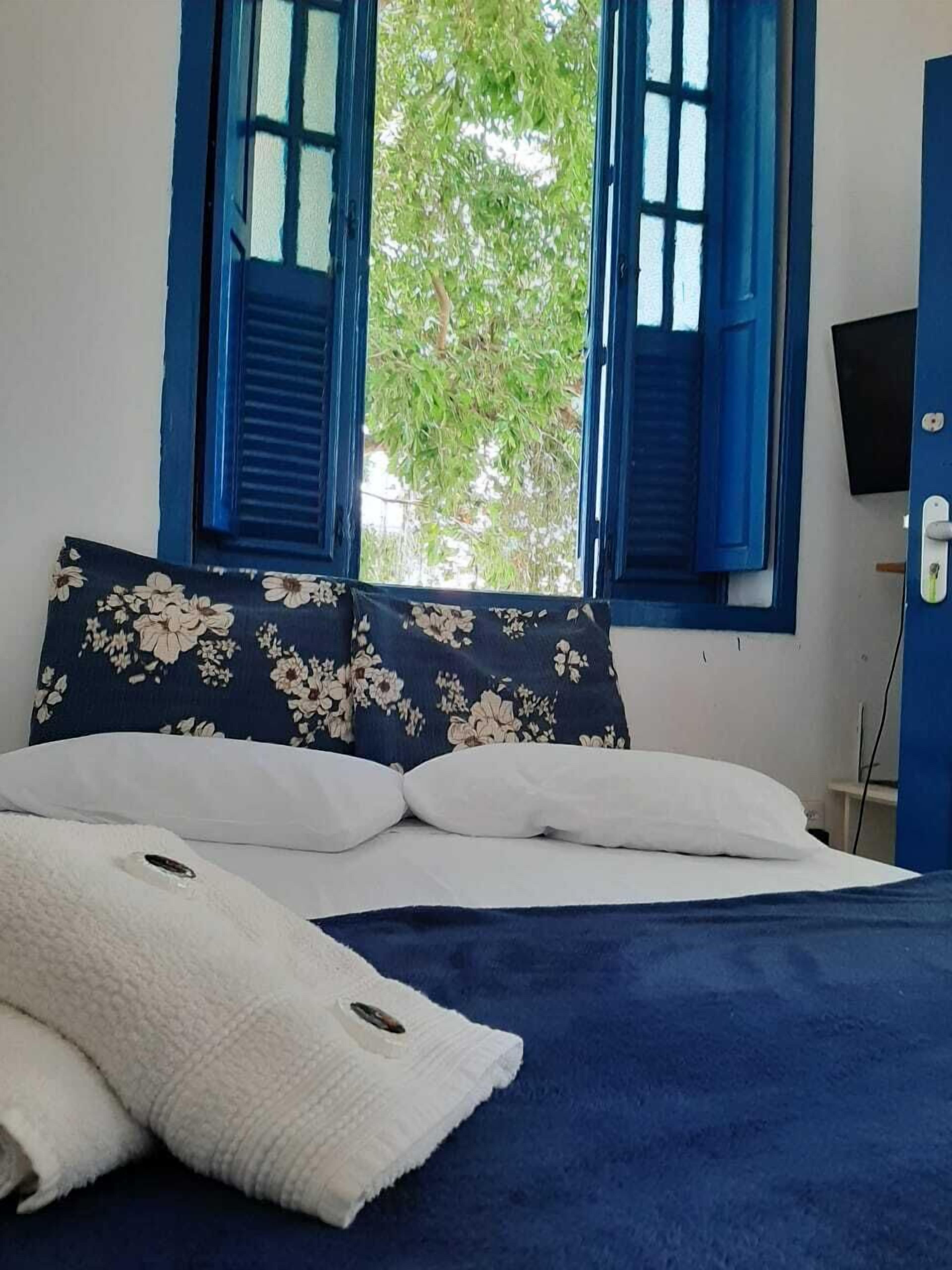 Suíte standard, 1 cama de casal, banheiro privativo | Roupas de cama premium, ferros/tábuas de passar roupa, Wi-Fi de cortesia