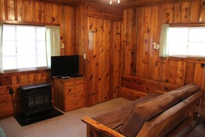Luxury Cottage (Cabin 9 - In Room Hot Tub) | Living room | 40-inch flat-screen TV with satellite channels, TV, Hulu
