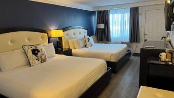 Desk, blackout drapes, iron/ironing board, rollaway beds