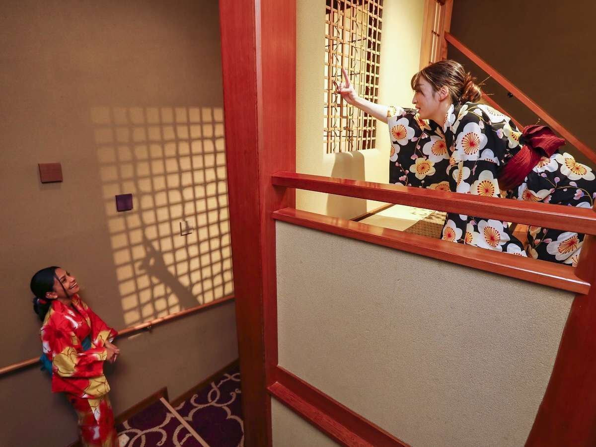 A traditional Japanese interior with tatami flooring and shoji screens.
