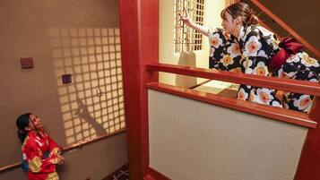 A traditional Japanese interior with tatami flooring and shoji screens.