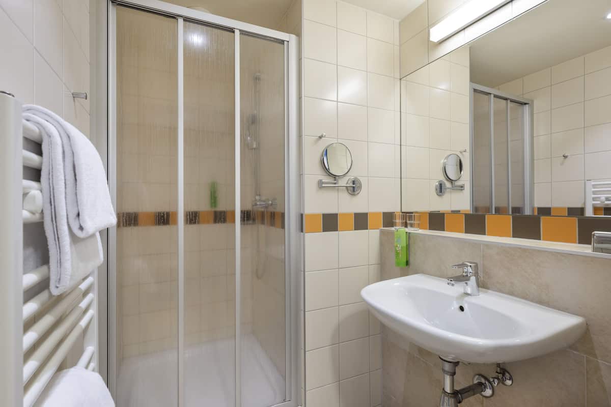 basic quadruple room | bathroom | shower, hair dryer, towels