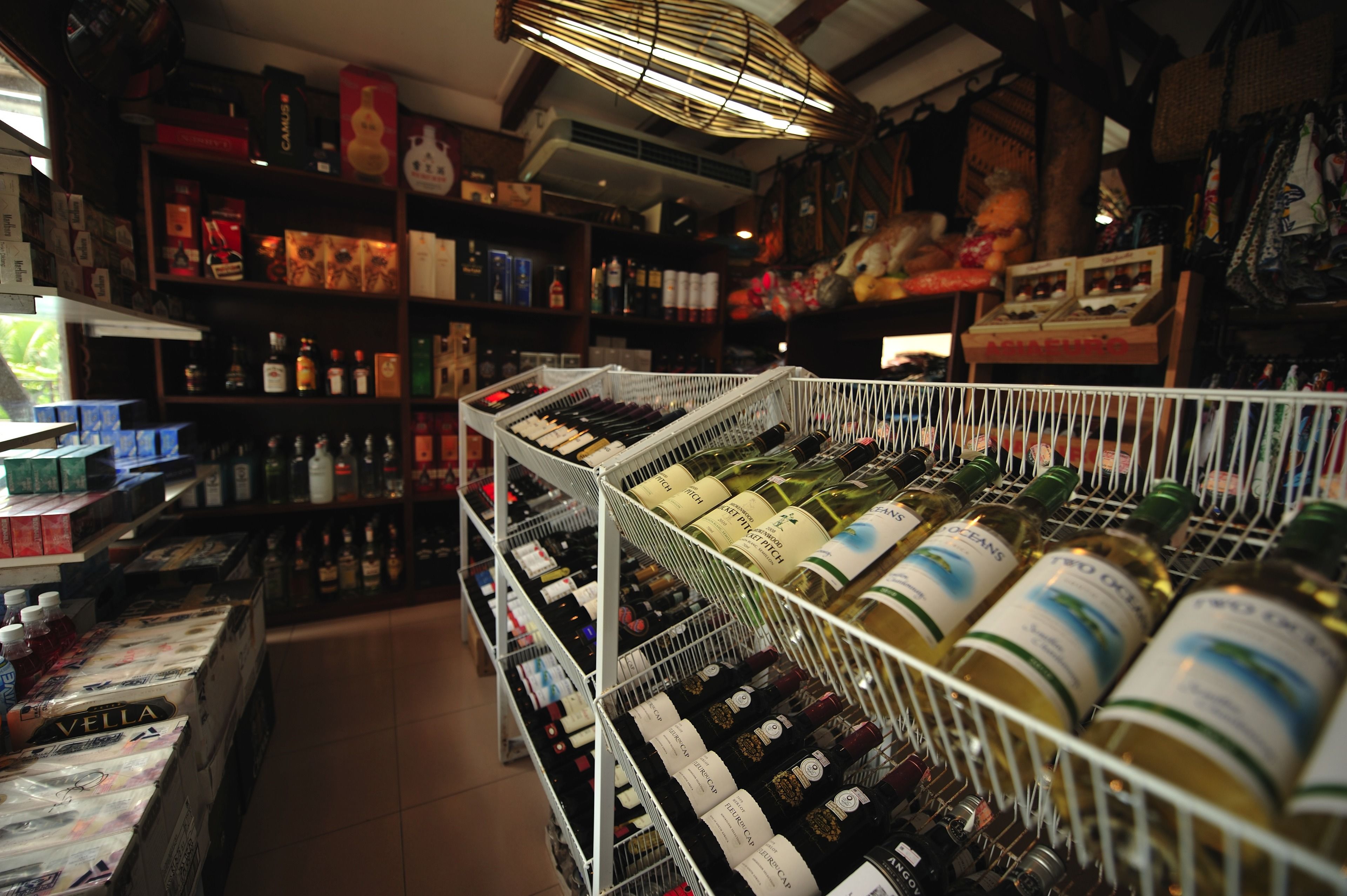 A wine store with shelves stocked with various bottles of wine.