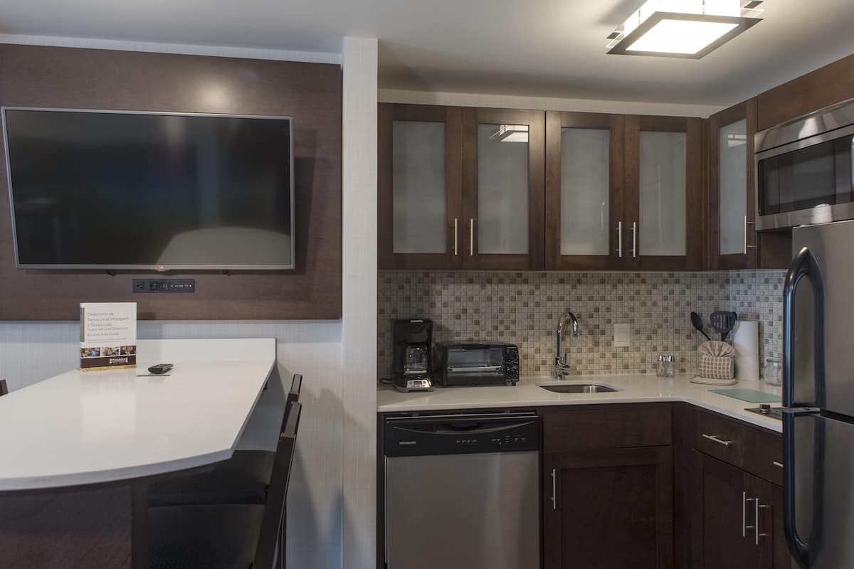suite, 1 bedroom, kitchen, mountain view | private kitchen | full-sized fridge, coffee/tea maker, cookware/dishes/utensils