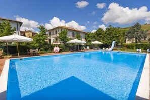 Seasonal outdoor pool, pool umbrellas, sun loungers