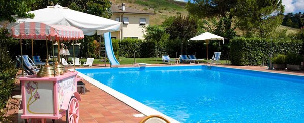 Seasonal outdoor pool, pool umbrellas, sun loungers